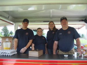 Ryan Killion, Cassie Richey, Shannon Strubhar and Greg Mahler staff the new trailer for it's first use at the Sweet Ride Car Show.